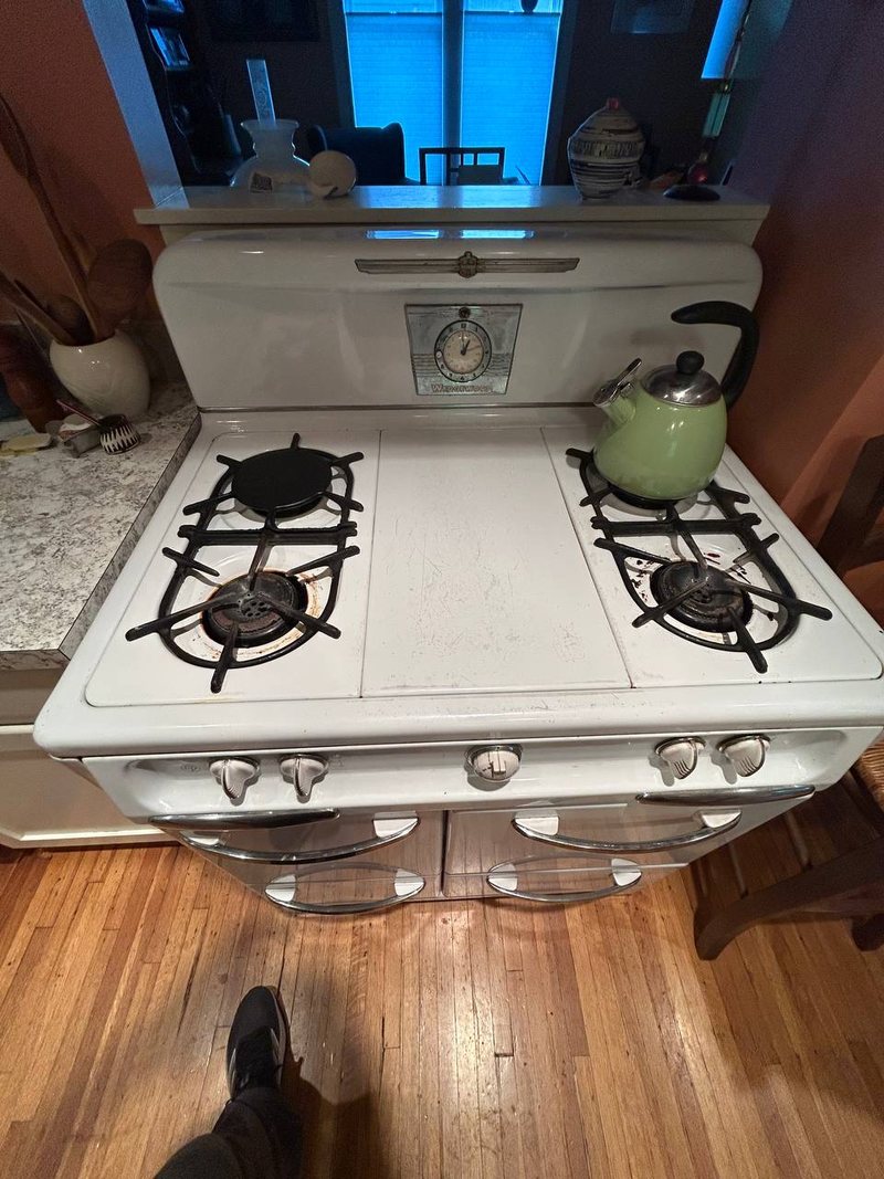 Vintage Wedgewood gas range in a south Minneapolis kitchen before a burner service